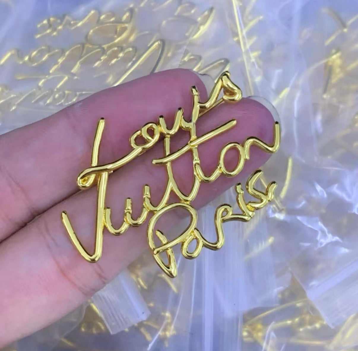 Lv brooch