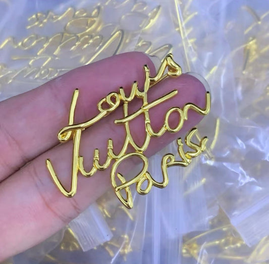 Lv brooch